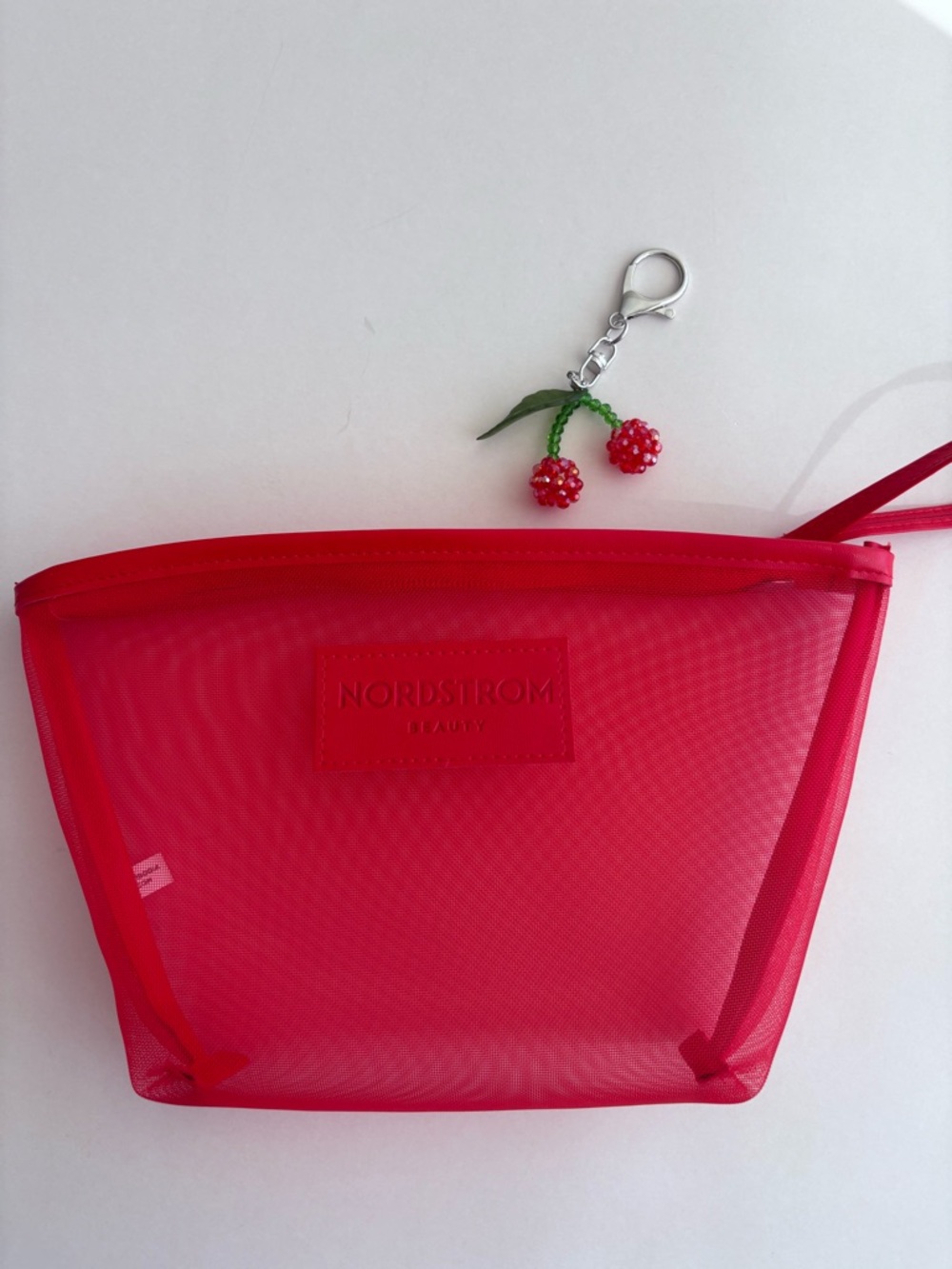 Nordstrom Beauty Bright Red Mesh Cosmetic Pouch with Wrist Strap and Cherry Char